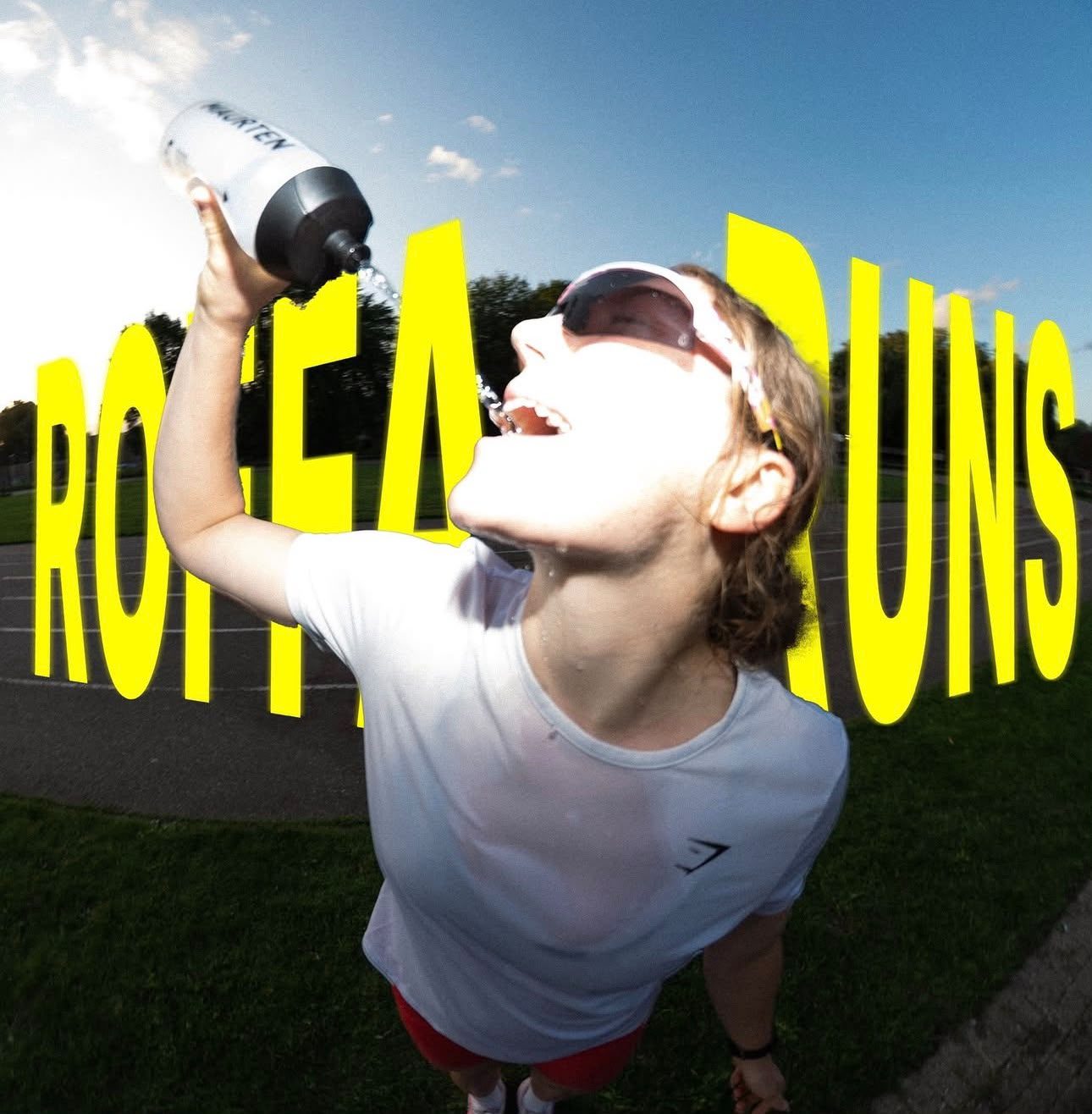 Runner drinking water on the track after the run